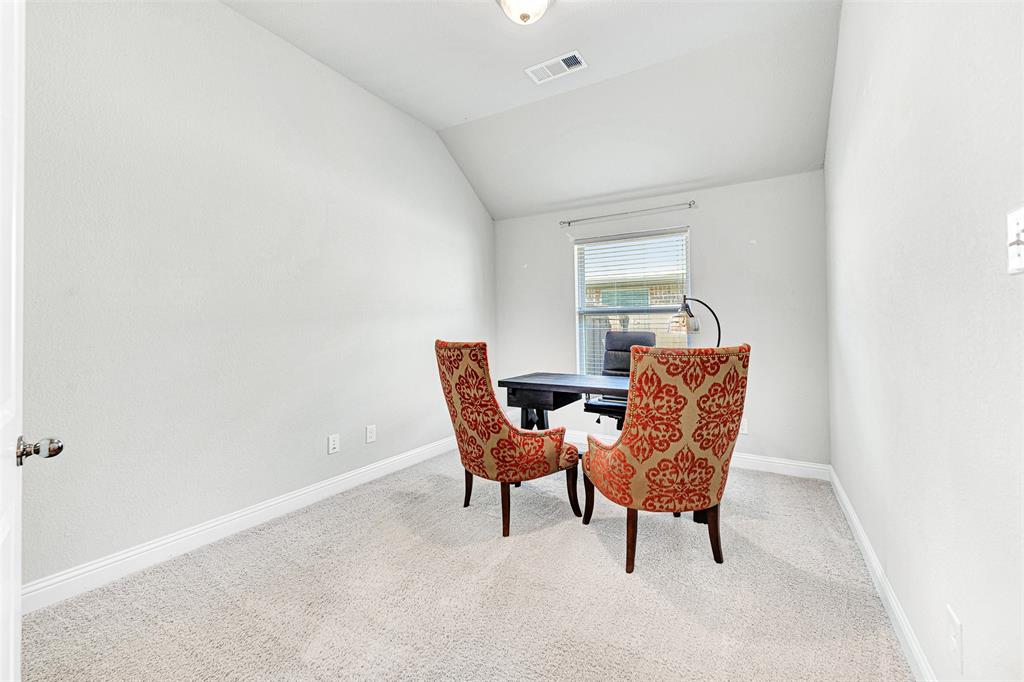 1313 Torrington Lane Forney, TX 75126 - Photo 9 of 21 a room with a chair and a window