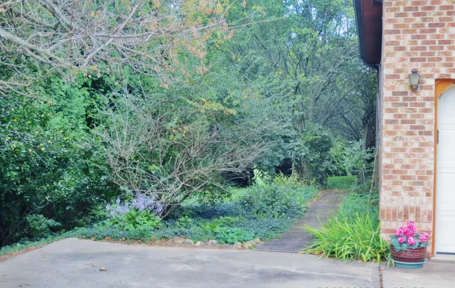 a view of a livingroom with furniture and an empty room