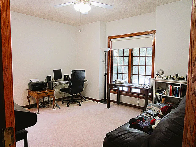 a view of a dining room with furniture and window