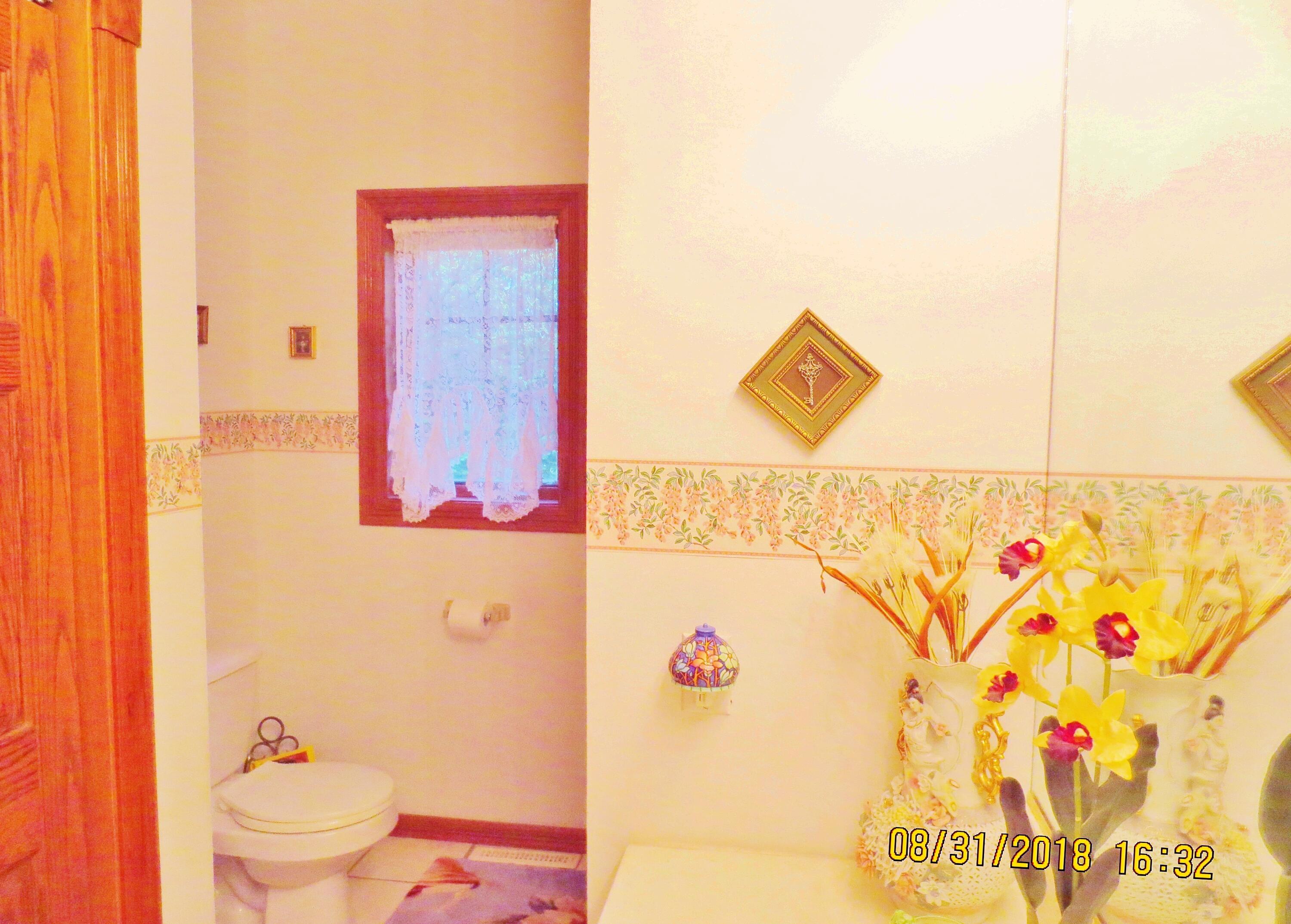 643 North 50 West Valparaiso, IN 46385 - Photo 34 of 62 a bathroom with a toilet and a shower curtain