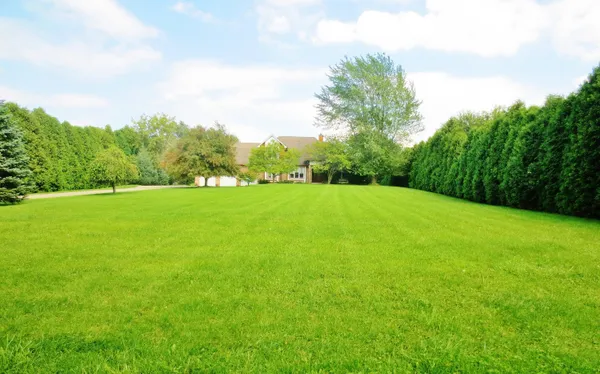 a view of a dining room with furniture and window