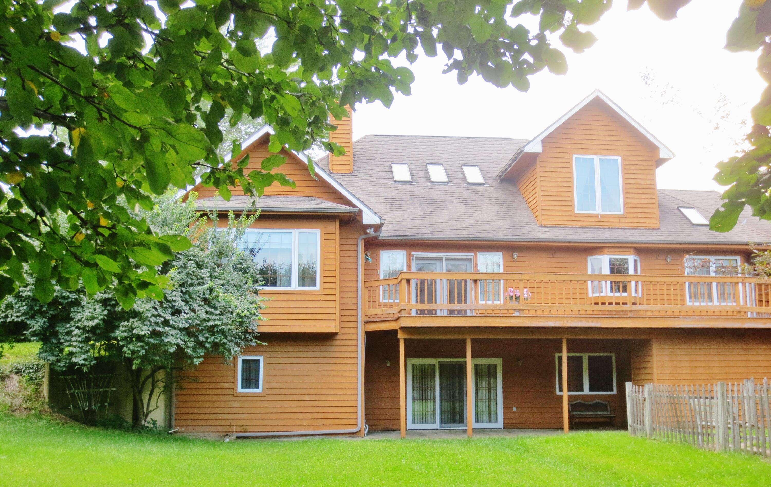643 North 50 West Valparaiso, IN 46385 - Photo 8 of 62 a front view of a house with a garden and plants