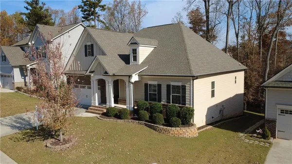 a front view of a house with a yard