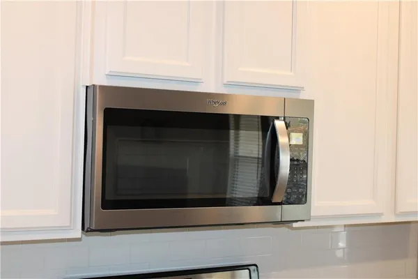a close view of a fireplace with wooden floor