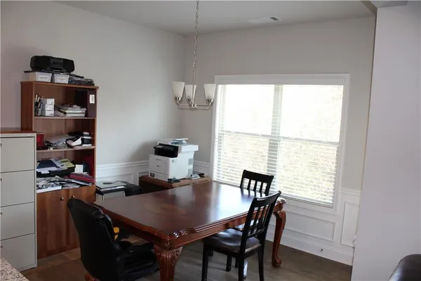 a kitchen with a refrigerator and cabinets