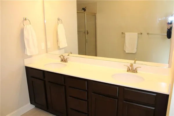 a view of a balcony with a table and chairs