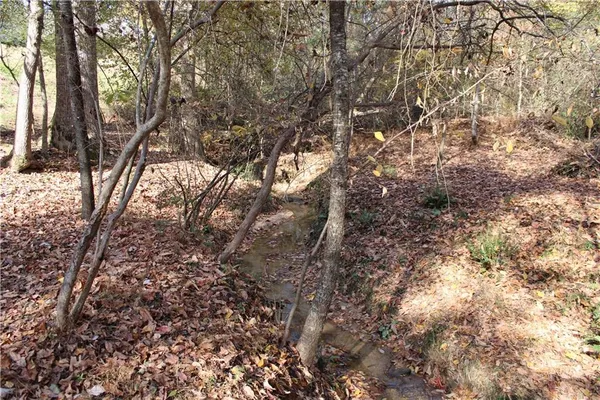 a view of a backyard with sitting area