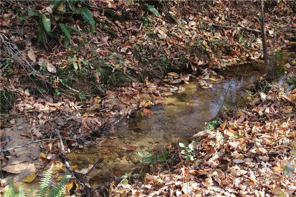an aerial view of a houses with yard