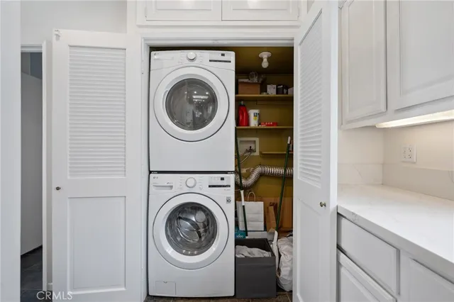 a view of kitchen with furniture and refrigerator