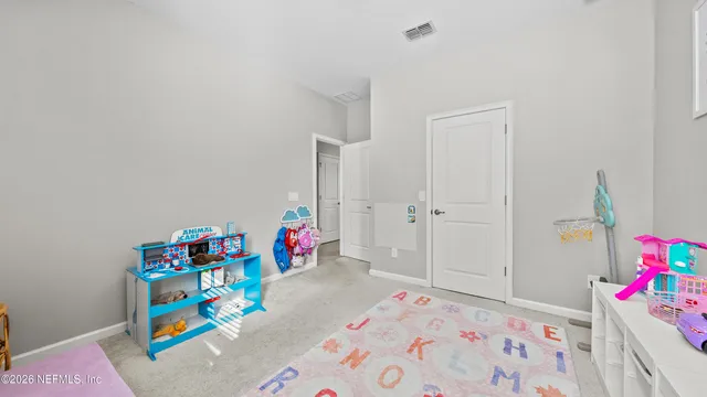 a kitchen with kitchen island granite countertop a refrigerator oven a sink and dishwasher