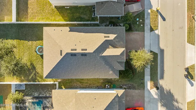aerial view of a house with a swimming pool