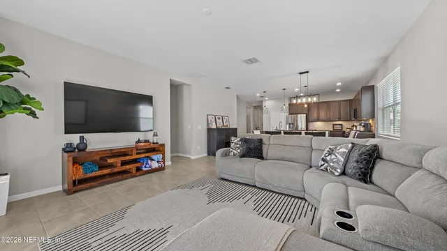 a bedroom with a bed and a large mirror