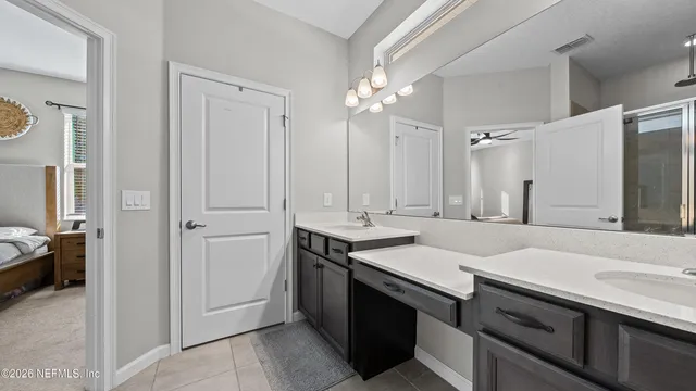 a white toilet sitting next to a shower