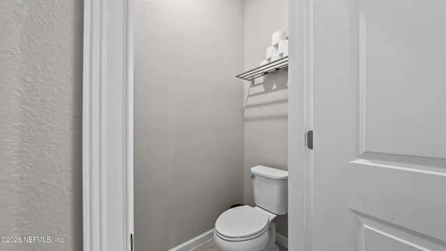 a bathroom with a shower and sink