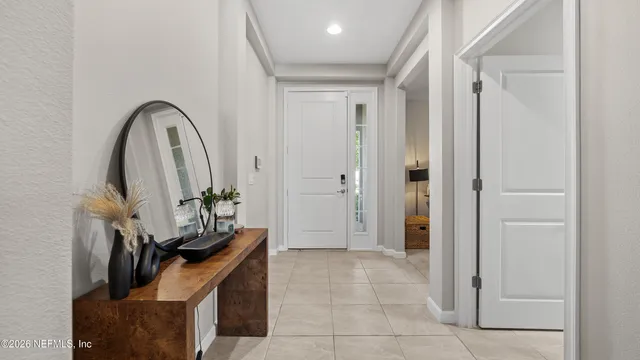 a view of an entryway with wooden floor