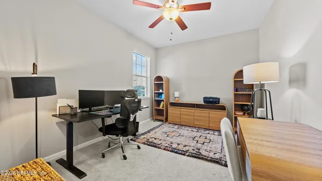 a bedroom with a workspace