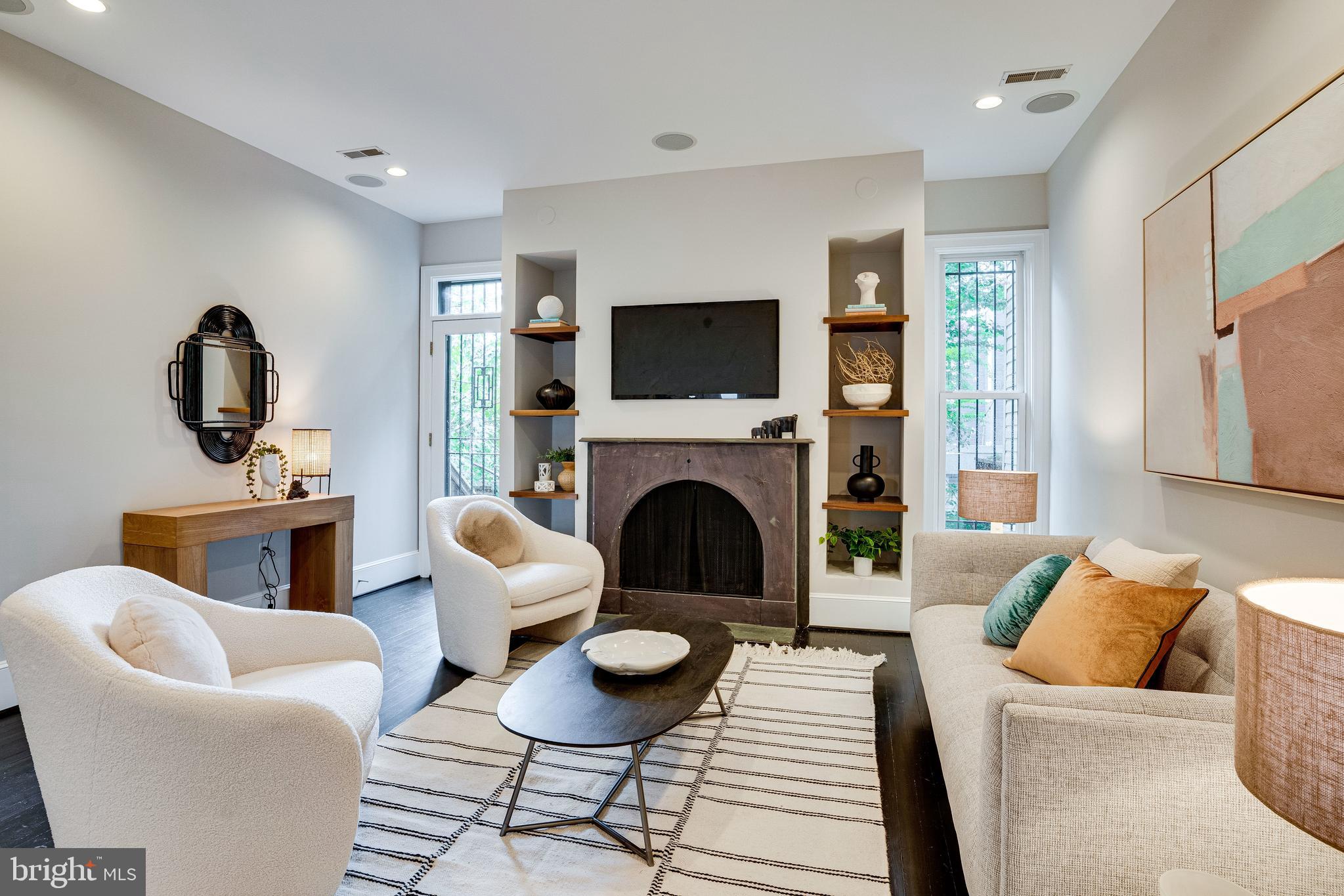 405 K Street Northeast Washington, DC 20002 - Photo 16 of 58 Living area at rear w/wood burning FP, built-ins