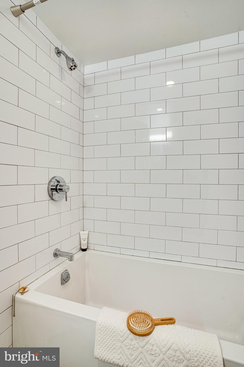 405 K Street Northeast Washington, DC 20002 - Photo 45 of 58 Subway-tiled tub in the basement unit