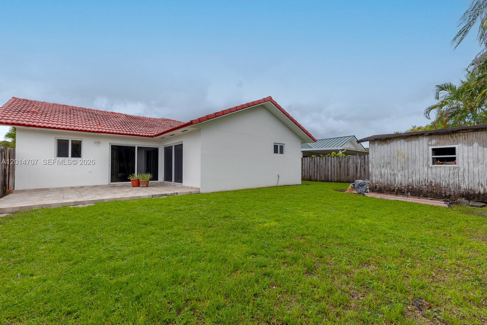 14452 Southwest 115th Street Miami, FL 33186 - Photo 17 of 17 a view of a house with backyard and garden