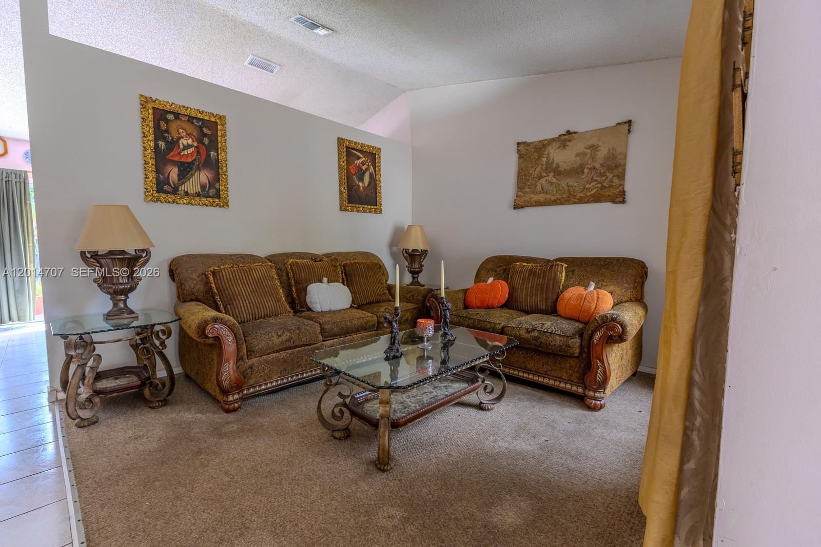 14452 Southwest 115th Street Miami, FL 33186 - Photo 3 of 17 a living room with furniture and a couch