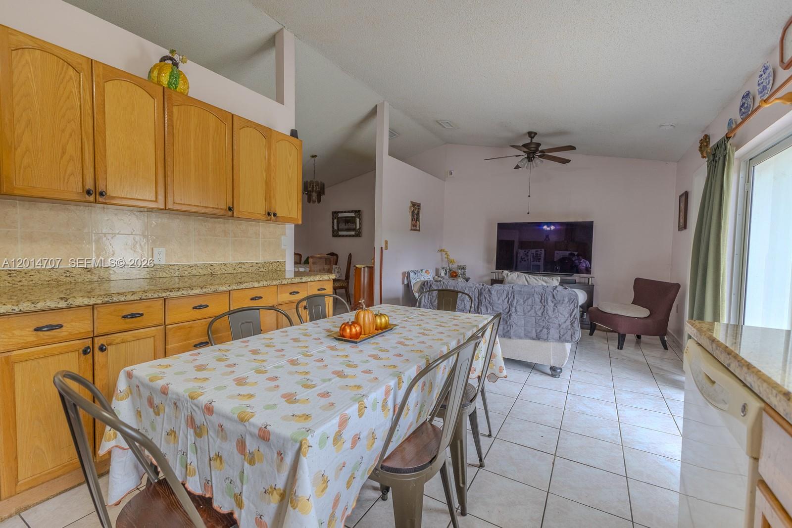 14452 Southwest 115th Street Miami, FL 33186 - Photo 6 of 17 a view of kitchen with cabinets and wooden floor