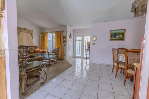 a view of a livingroom with furniture and a window