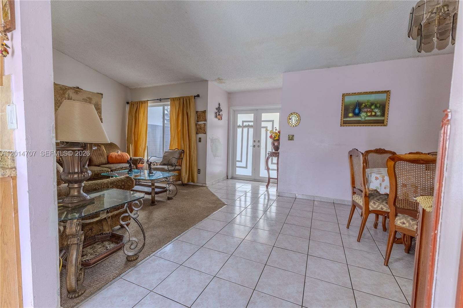 14452 Southwest 115th Street Miami, FL 33186 - Photo 8 of 17 a view of a livingroom with furniture and a window