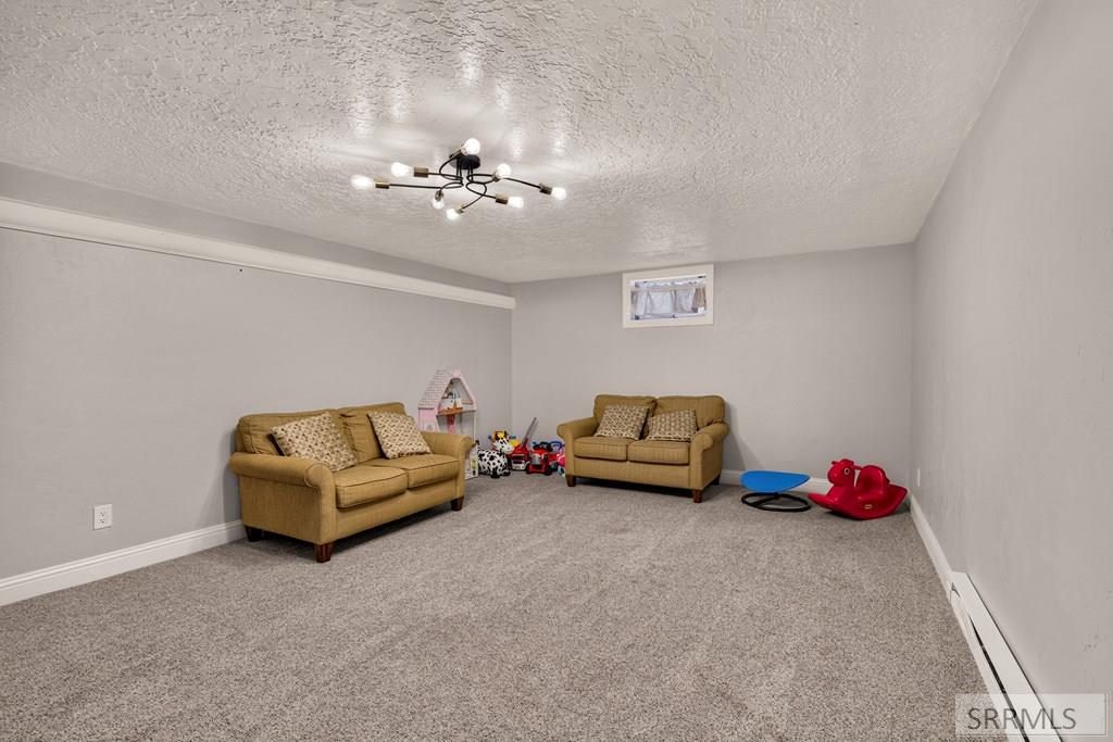 3974 East Wanda Ammon, ID 83406 - Photo 36 of 66 Basement Family Room