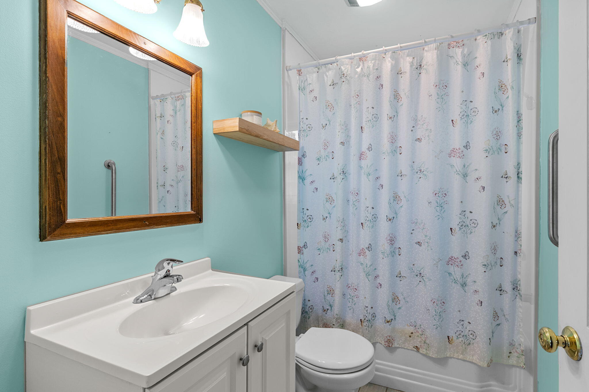 123 Tower Hill Road Osterville, MA 02655 - Photo 13 of 38 a bathroom with a sink a toilet and shower curtain