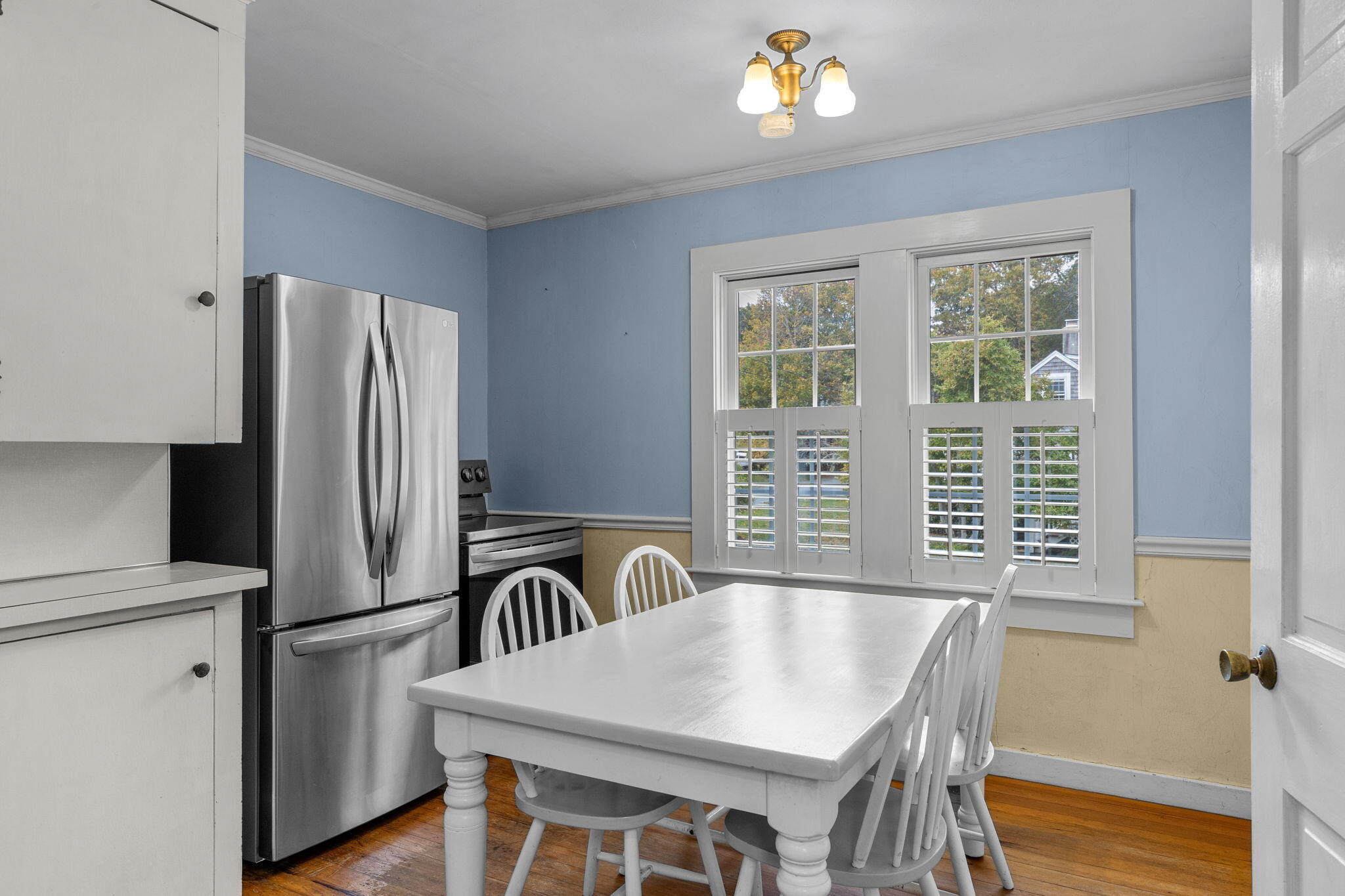 123 Tower Hill Road Osterville, MA 02655 - Photo 16 of 38 a kitchen with stainless steel appliances granite countertop a refrigerator a sink a stove and a dining table