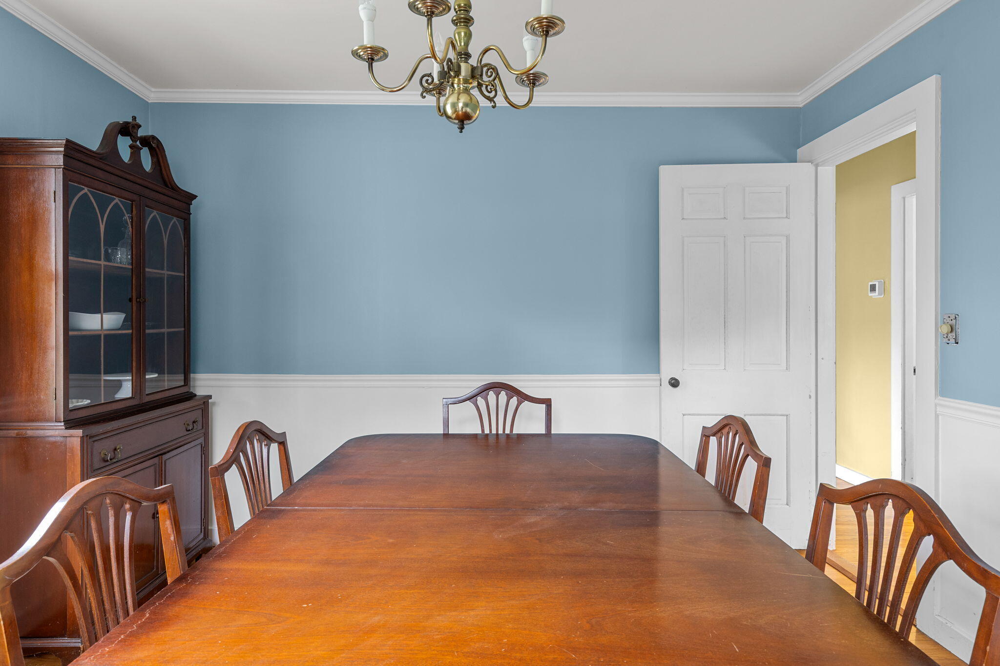 123 Tower Hill Road Osterville, MA 02655 - Photo 10 of 38 a bedroom with a bed and dresser with windows