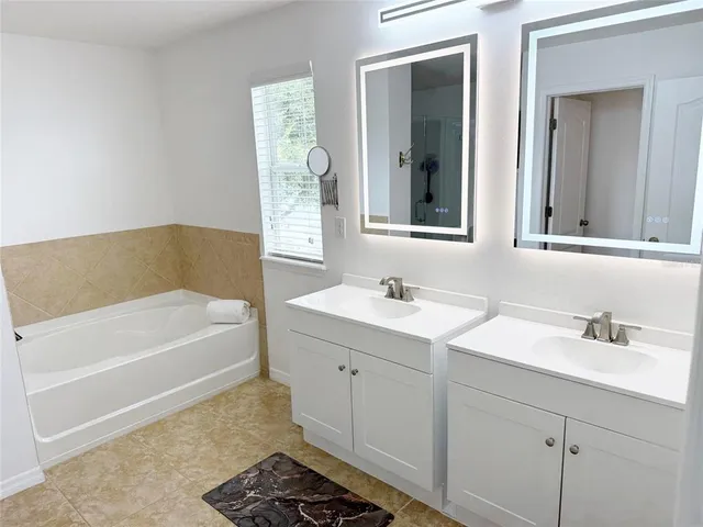 a view of a swimming pool with chairs