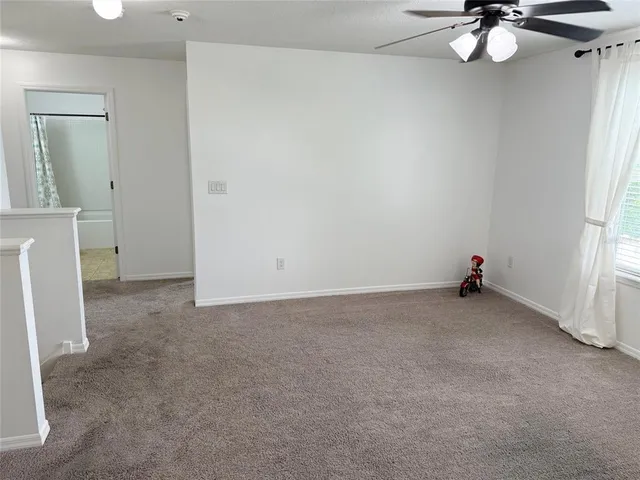 a view of a chairs and table in the patio