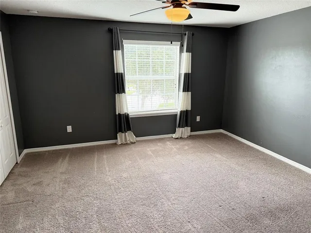 a kitchen with granite countertop a sink and a white stainless steel appliances