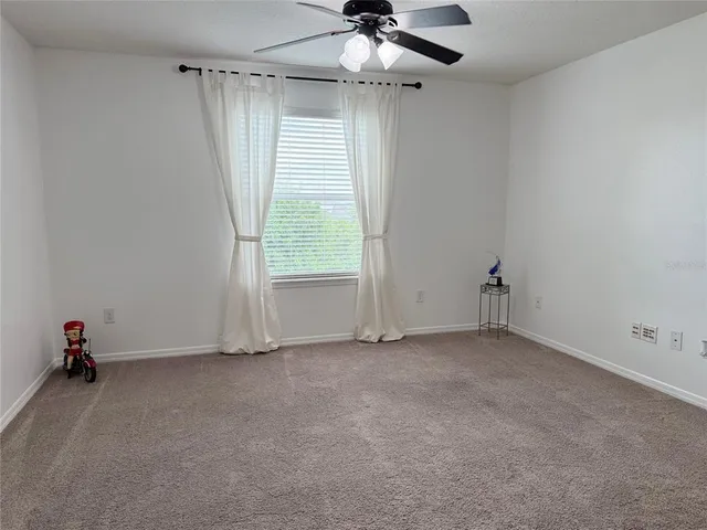 a kitchen with a granite countertop kitchen island a sink stainless steel appliances and a counter top