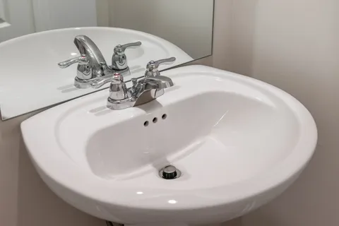 a view of kitchen with refrigerator a microwave and cabinets