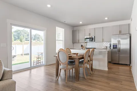 a kitchen with a sink a stove a microwave and cabinets