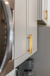 a bedroom with a bed and a mirror