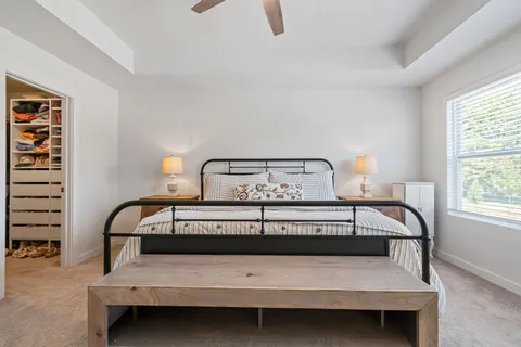 a bedroom with furniture and a window