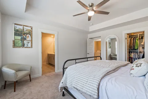 a view of a backyard with table and chairs and potted plants