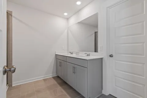 a view of a house with backyard sitting area and garden