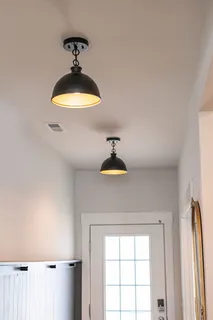 a view of a livingroom with wooden floor and windows