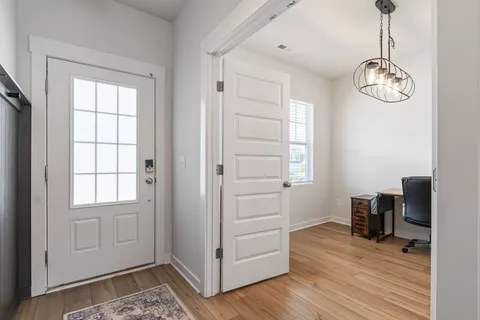 a bathroom with a sink toilet and mirror