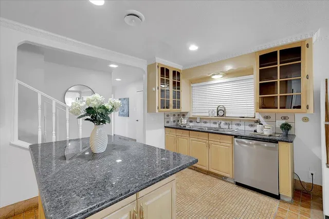 a kitchen with stainless steel appliances granite countertop a sink a granite counter tops and a granite counter tops