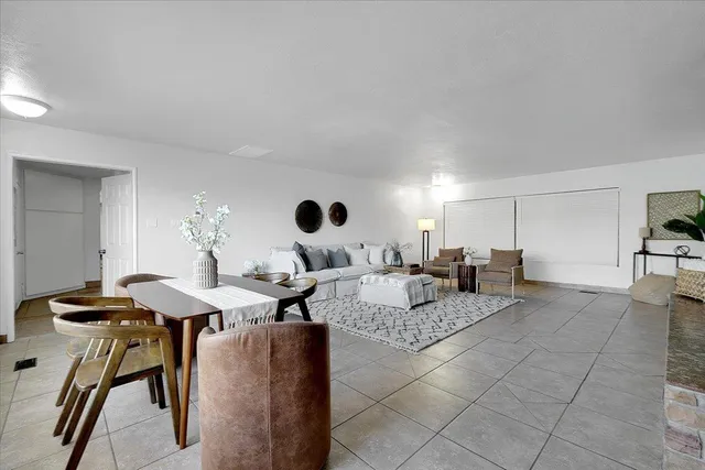 a living room with furniture and a table