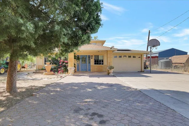 a man sitting on a bench in front of a building