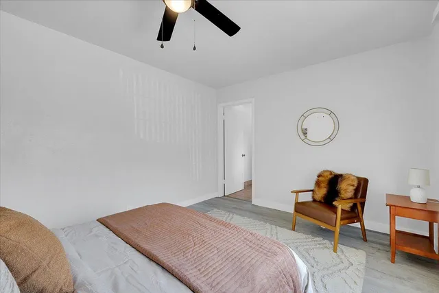 a spacious bathroom with a double vanity sink and mirror