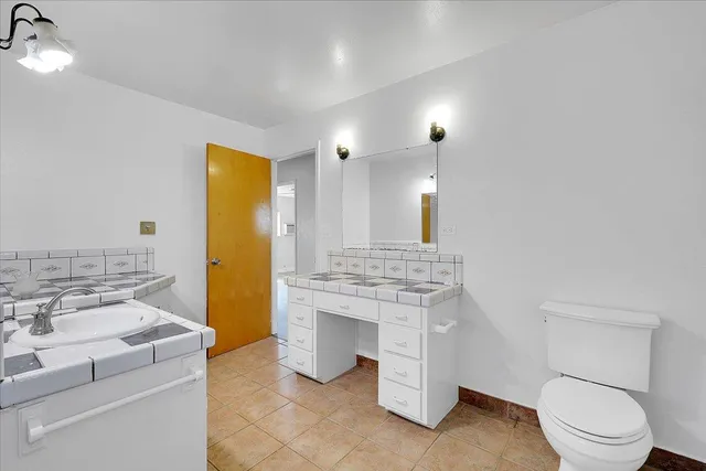 a bathroom with a bathtub and a toilet