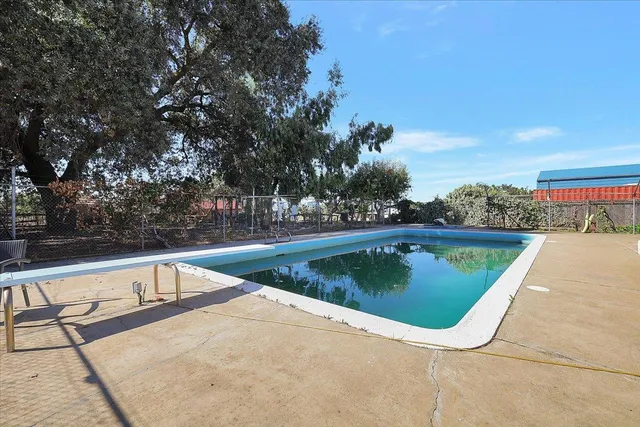 a view of a backyard with sitting area