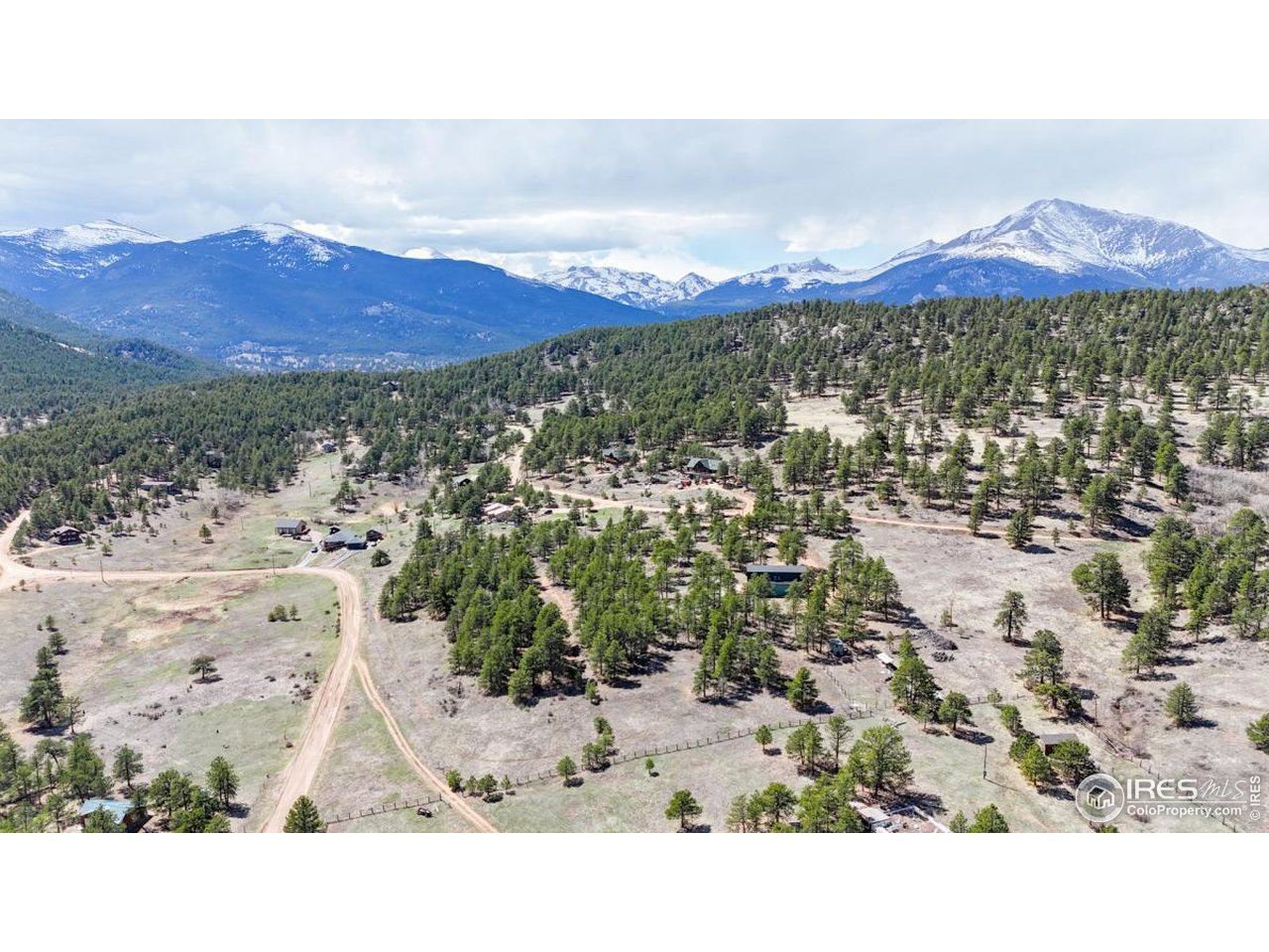 598 Taylor Road Lyons, CO 80540 - Photo 27 of 32 a view of a city with mountains in the background